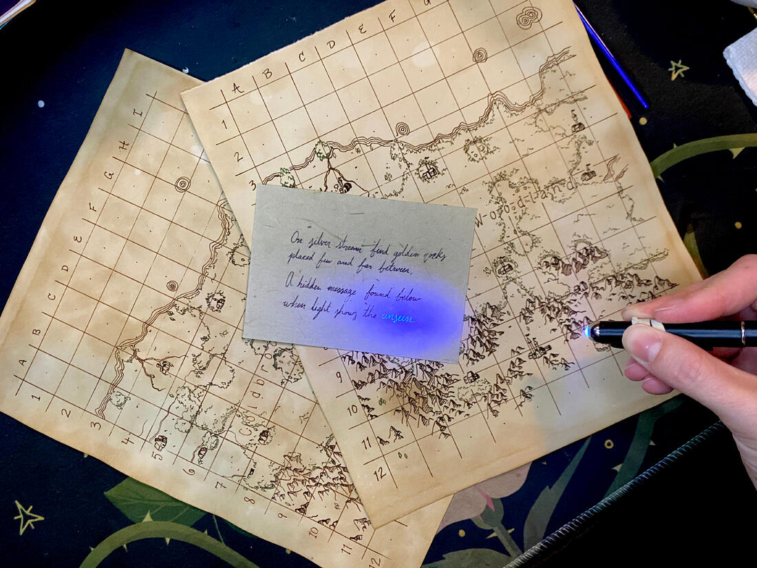 The maps and one of the notes, showing hidden writing with a blacklight.